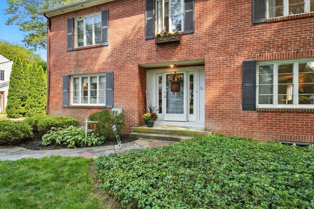 35 Plymouth Road Longmeadow, MA 01106 - Photo 36 of 41 front view of a brick house with a yard