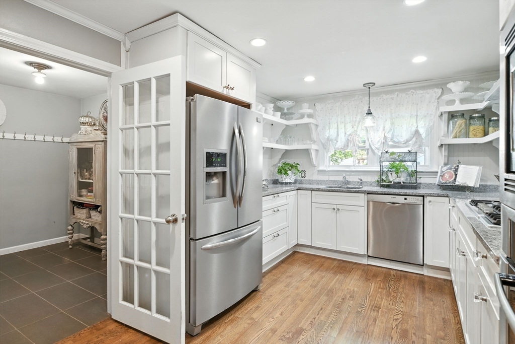 35 Plymouth Road Longmeadow, MA 01106 - Photo 10 of 41 a kitchen with stainless steel appliances a refrigerator sink and microwave