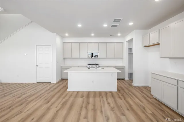 a view of kitchen with wooden floor