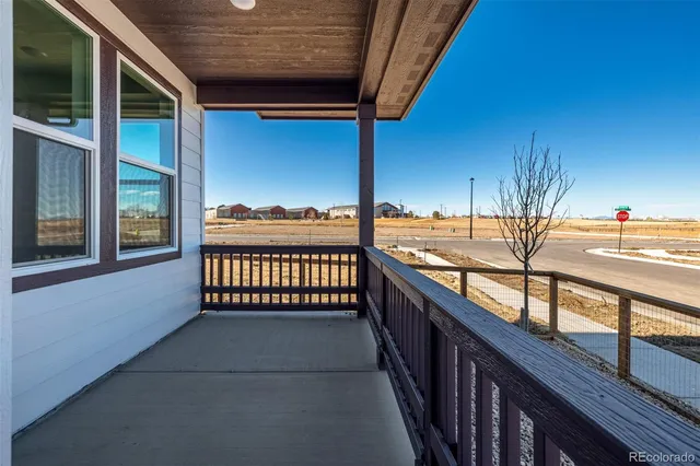 a view of a balcony with chairs