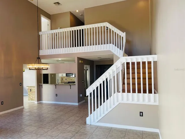 a view of staircase with a white furniture