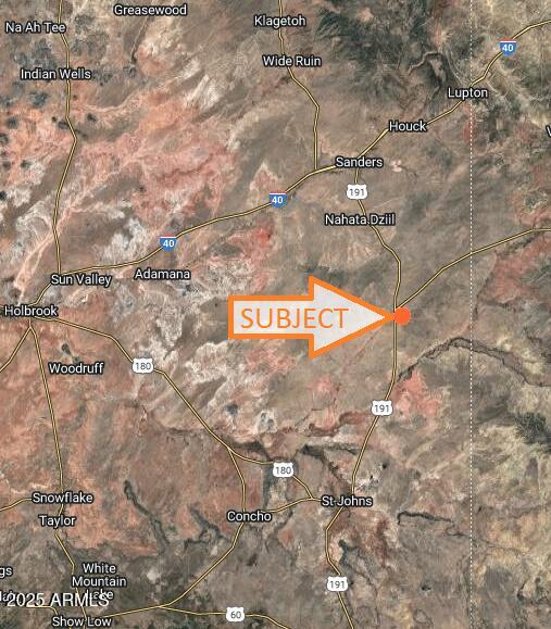 a view of outdoor space with brick wall and stairs