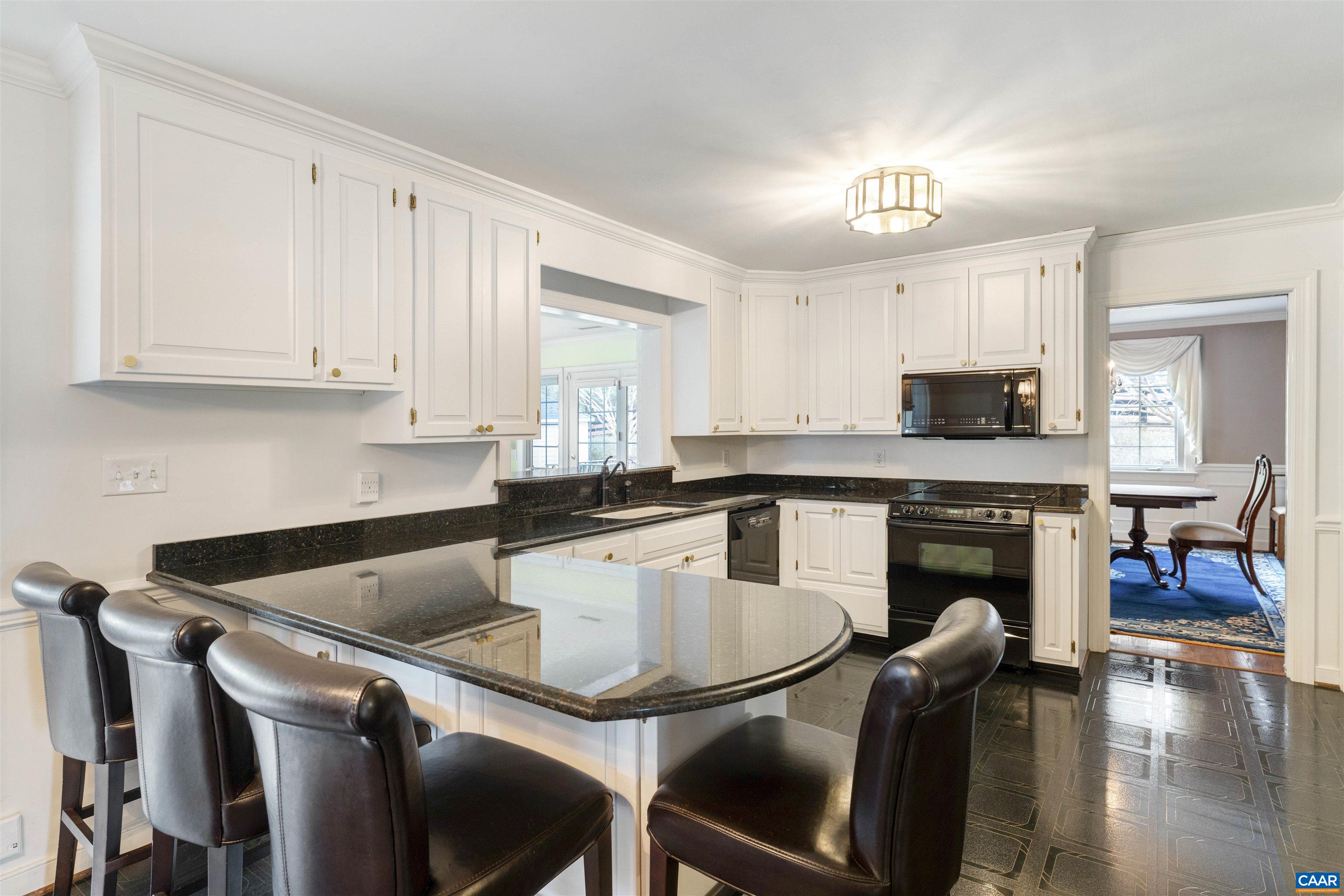 1789 Stony Point Road Charlottesville, VA 22911 - Photo 6 of 46 a kitchen with a table chairs sink and cabinets