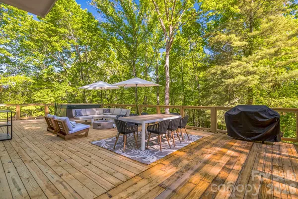 a view of a backyard with sitting area