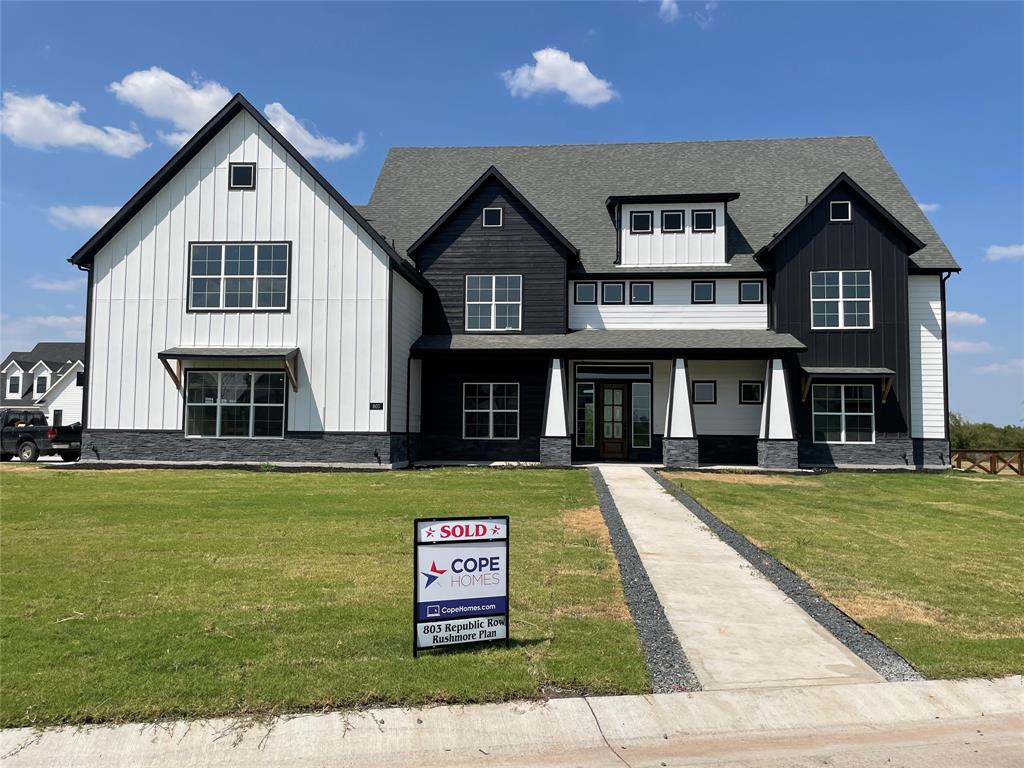 a front view of a house with swimming pool having outdoor seating