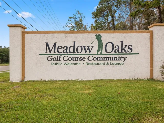 an aerial view of a house with a swimming pool