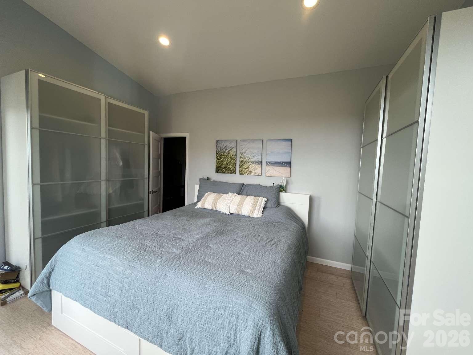 3445 Irish Hills Road Morganton, NC 28655 - Photo 17 of 34 a bedroom with a bed and a mirror