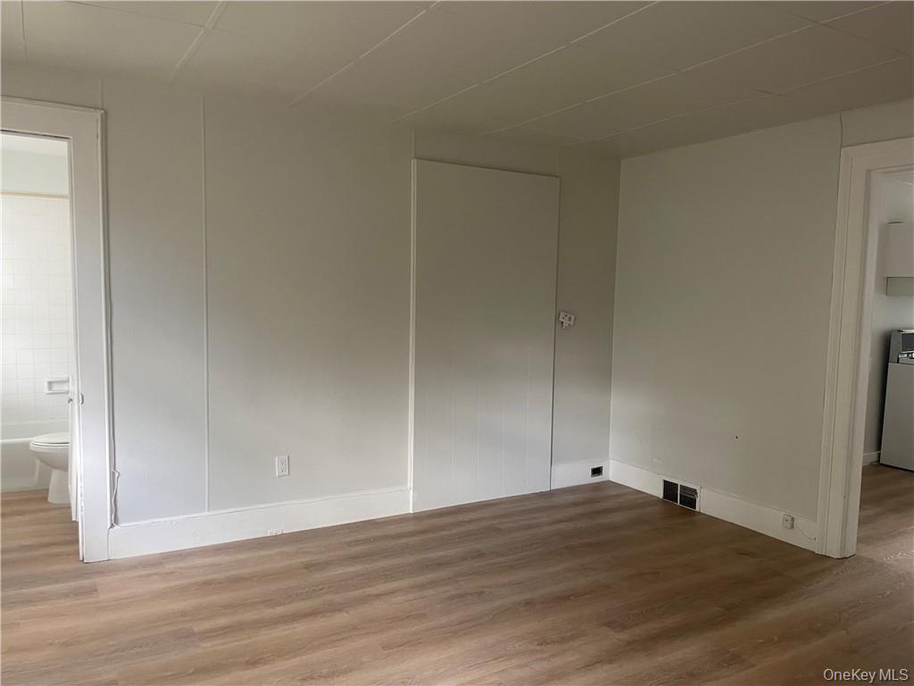 8 Mansion Street, Unit 2 Poughkeepsie, NY 12601 - Photo 5 of 10 a view of an empty room and wooden floor