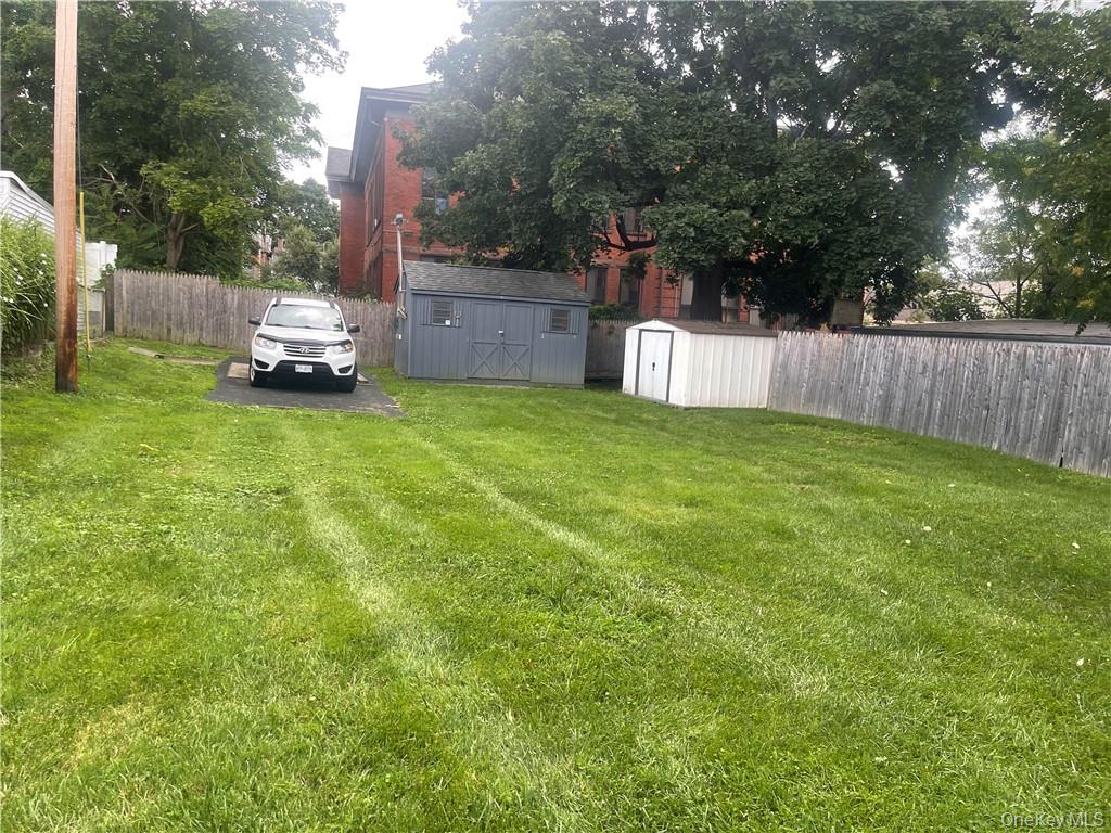 8 Mansion Street, Unit 2 Poughkeepsie, NY 12601 - Photo 10 of 10 a white house that has a tree in front of it