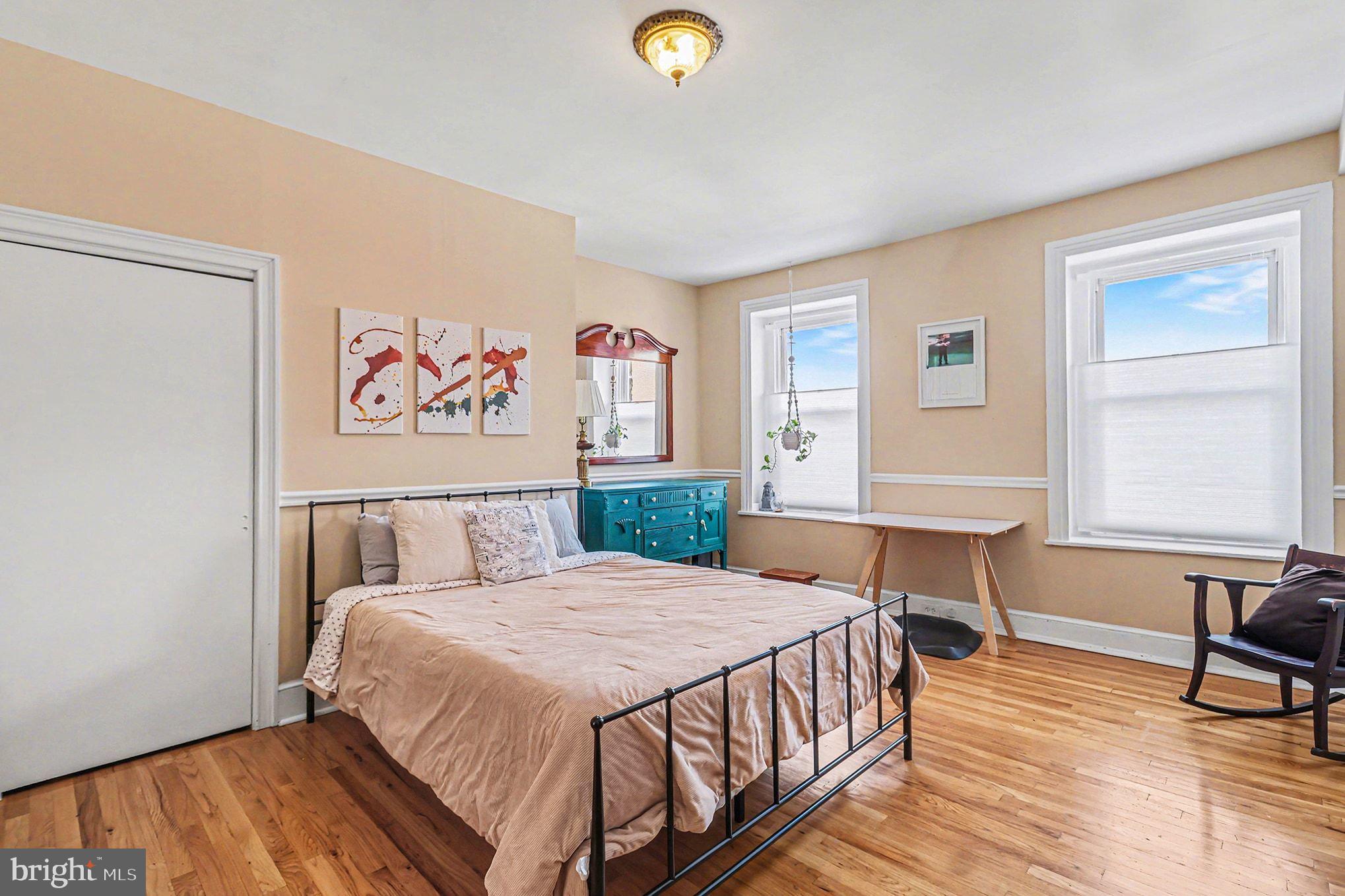 1410 Castle Avenue Philadelphia, PA 19145 - Photo 18 of 38 a bedroom with a bed and a table in it