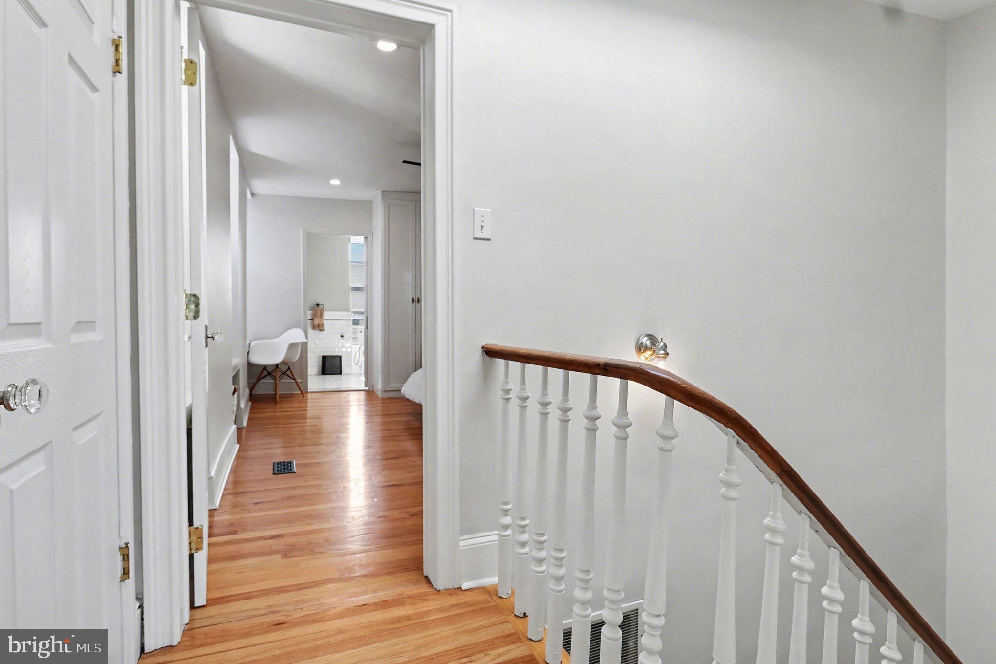 1410 Castle Avenue Philadelphia, PA 19145 - Photo 26 of 38 a view of a hallway with wooden floor and staircase