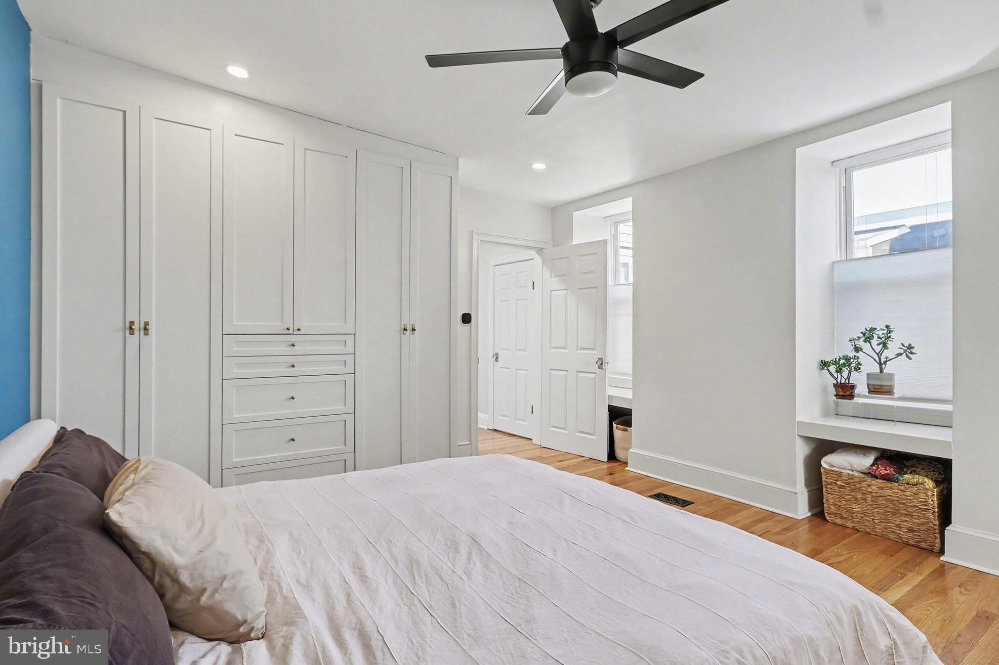 1410 Castle Avenue Philadelphia, PA 19145 - Photo 29 of 38 a bedroom with a bed and a chandelier