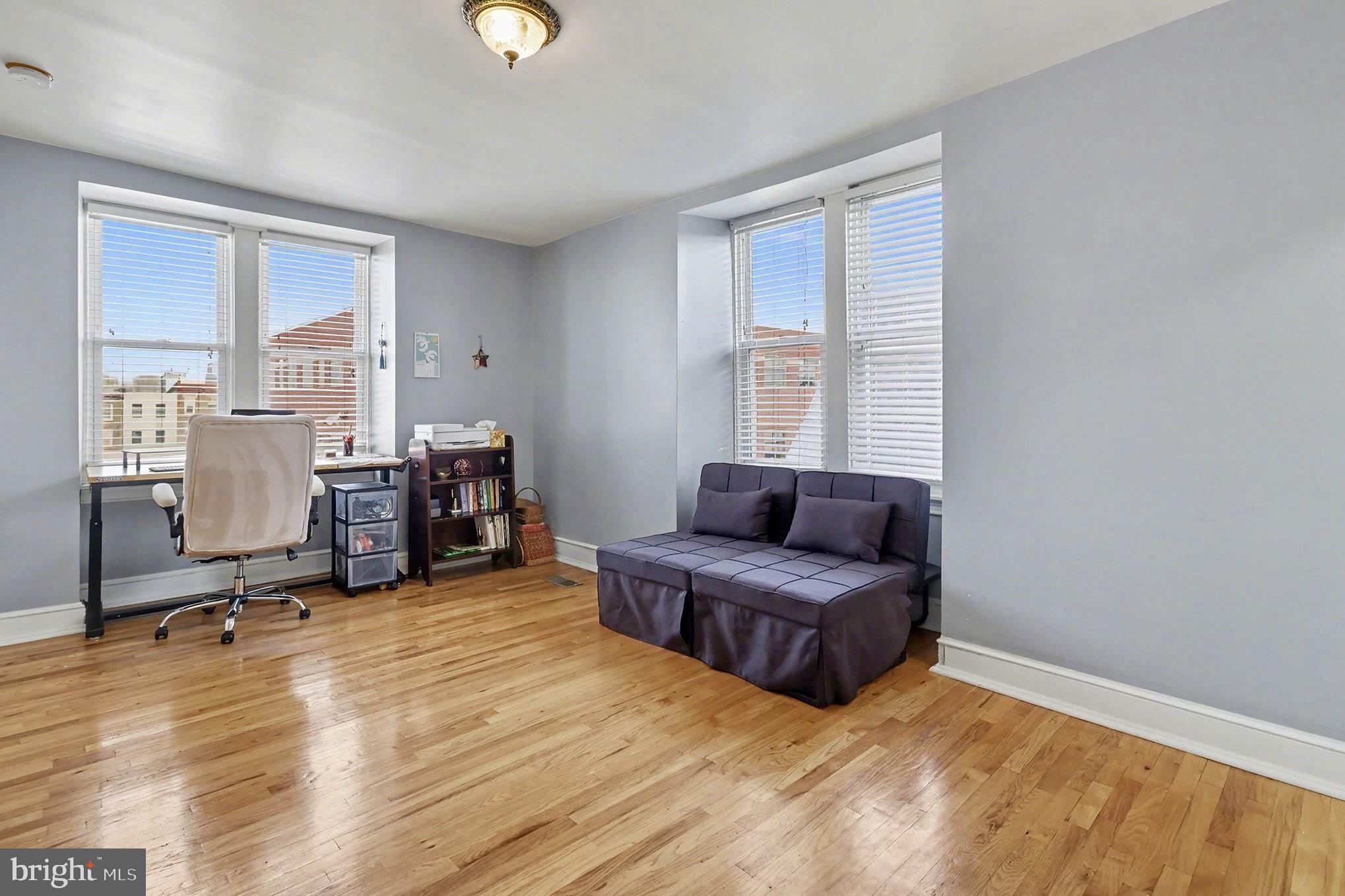 1410 Castle Avenue Philadelphia, PA 19145 - Photo 34 of 38 a living room with furniture and a flat screen tv