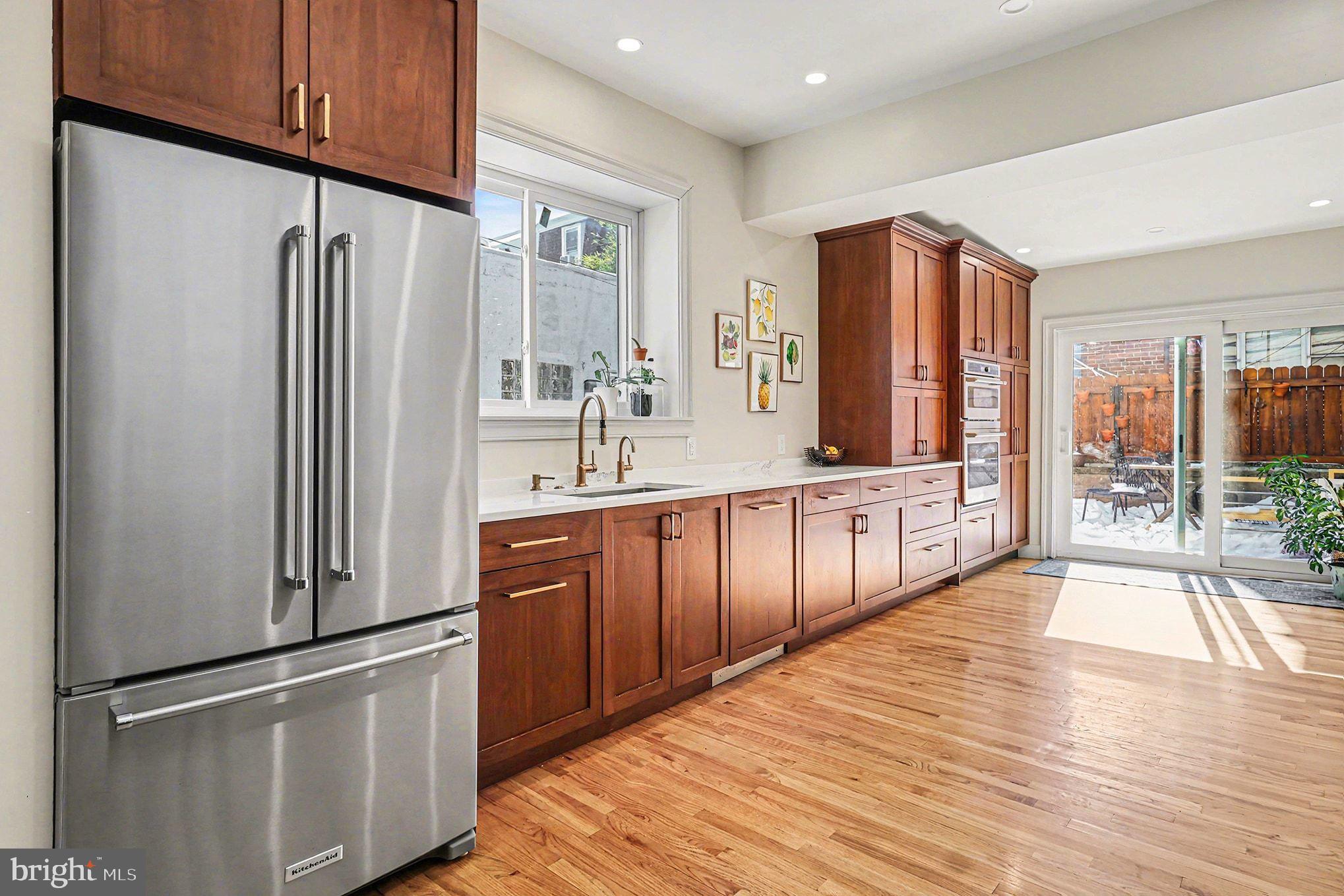 1410 Castle Avenue Philadelphia, PA 19145 - Photo 4 of 38 a kitchen with stainless steel appliances granite countertop a refrigerator a sink and dishwasher