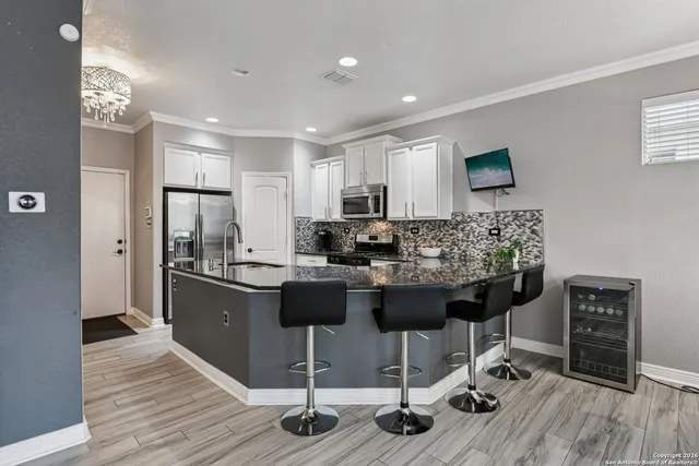 a view of kitchen island wooden floor furniture and living room