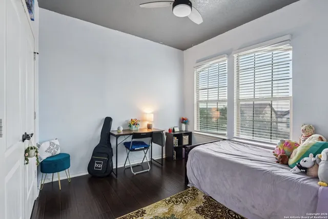 a living room with furniture and floor to ceiling windows