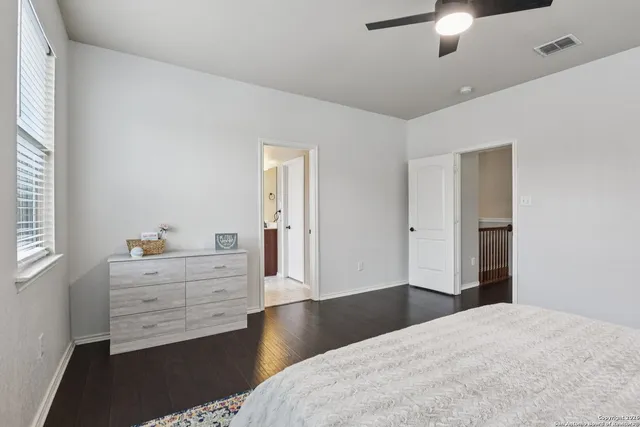 a bedroom with a bed and a dresser