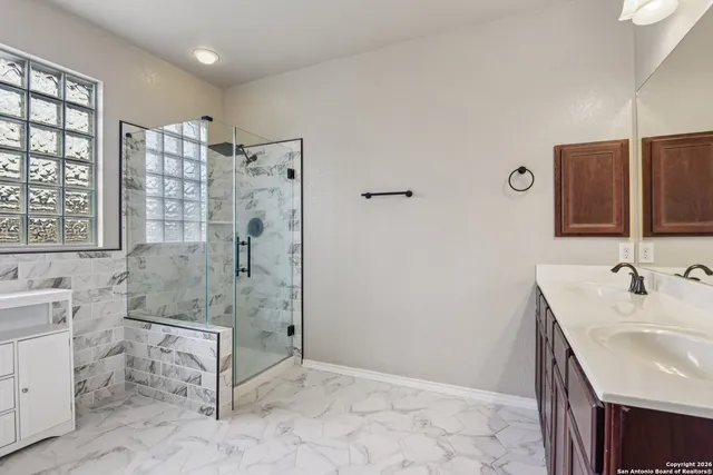 a bathroom with a sink and a mirror