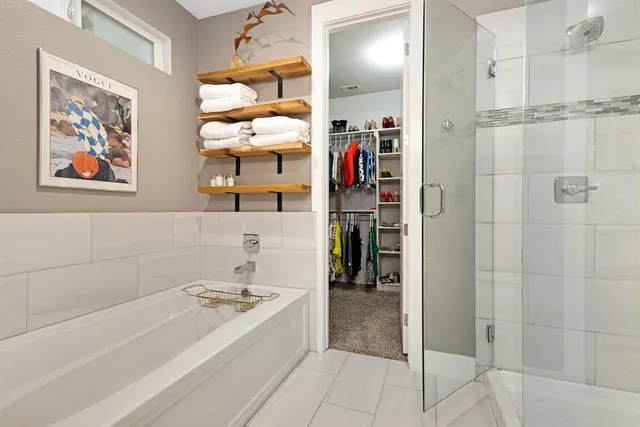 a spacious bathroom with a granite countertop sink and a mirror