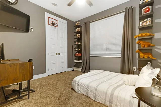 a spacious bathroom with a tub sink and mirror