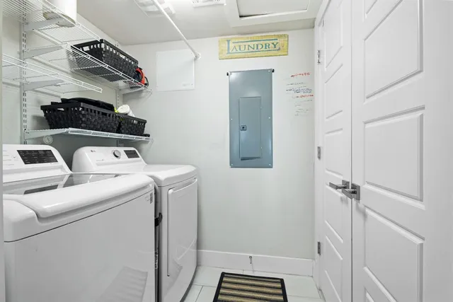 a bathroom with a tub a sink and a large mirror