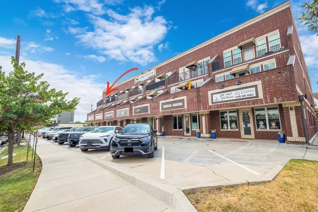 a room with furniture a flat screen tv and a book shelf