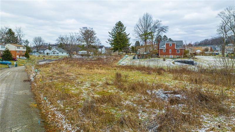 Lot 303 B Locust Ridge Drive Pittsburgh, PA 15209 - Photo 13 of 17 a view of a lake with houses