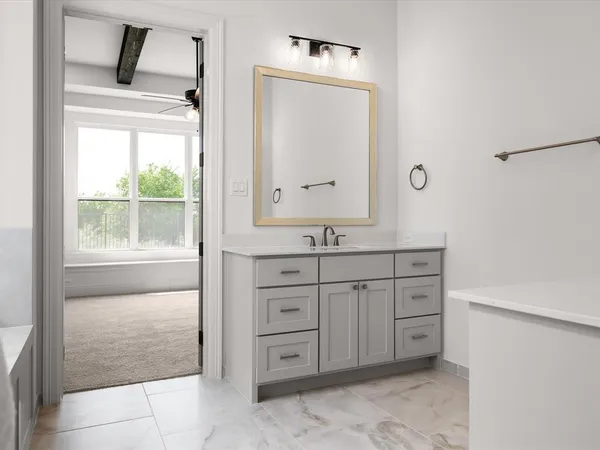 a bathroom with a granite countertop sink mirror and