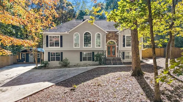 a front view of a house with a yard