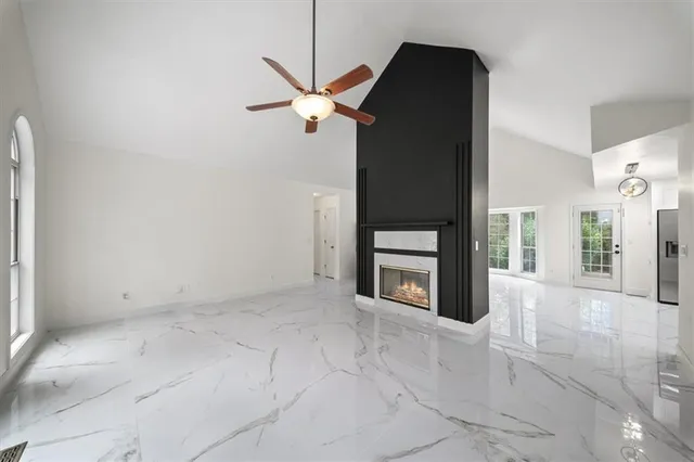 a kitchen with stainless steel appliances granite countertop a stove cabinets and a refrigerator