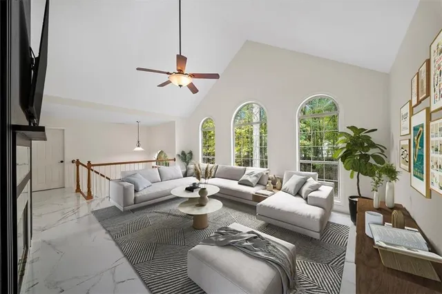 a bedroom with a bed a flat screen tv and a large window with the outer view