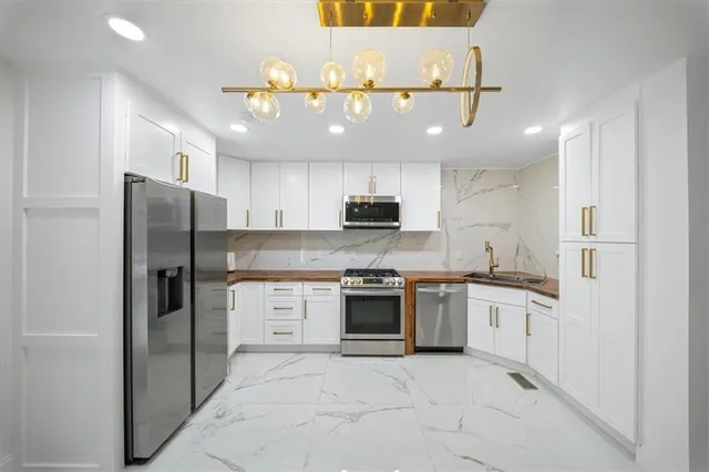 a bathroom with a bathtub and shower