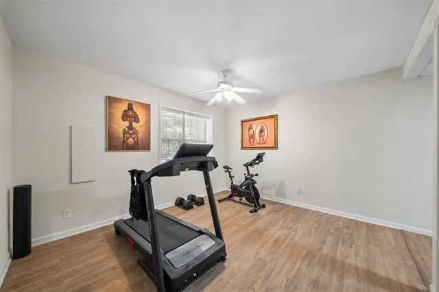 a kitchen with a refrigerator a stove a microwave a sink and dishwasher with wooden floor