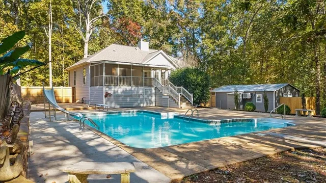 a bathroom with a sink a toilet a shower and a mirror