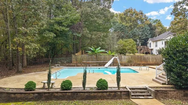 a bedroom with a bed and a table in it