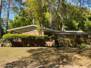 4605 Silver Ridge Drive Jacksonville, FL 32207 - Photo 1 of 6 an outdoor space with lots of trees