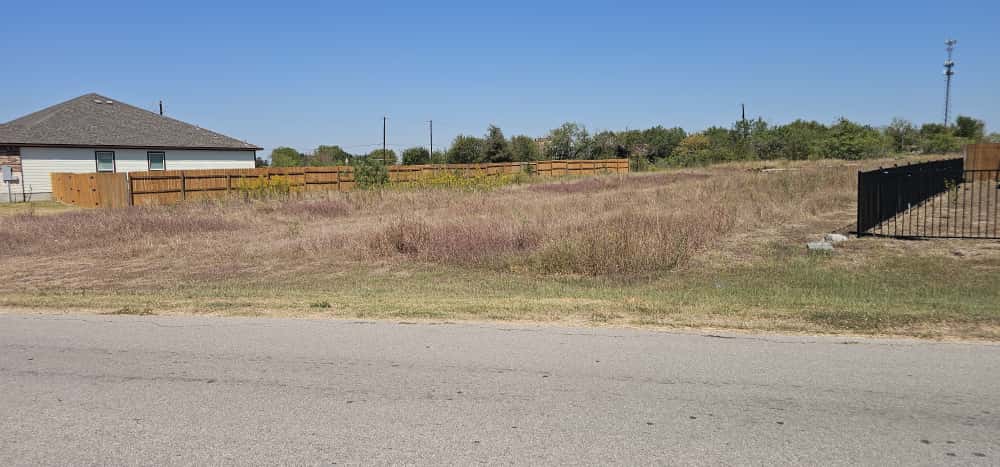 169 El Rey Drive Kyle, TX 78640 - Photo 3 of 10 View of yard featuring a rural view
