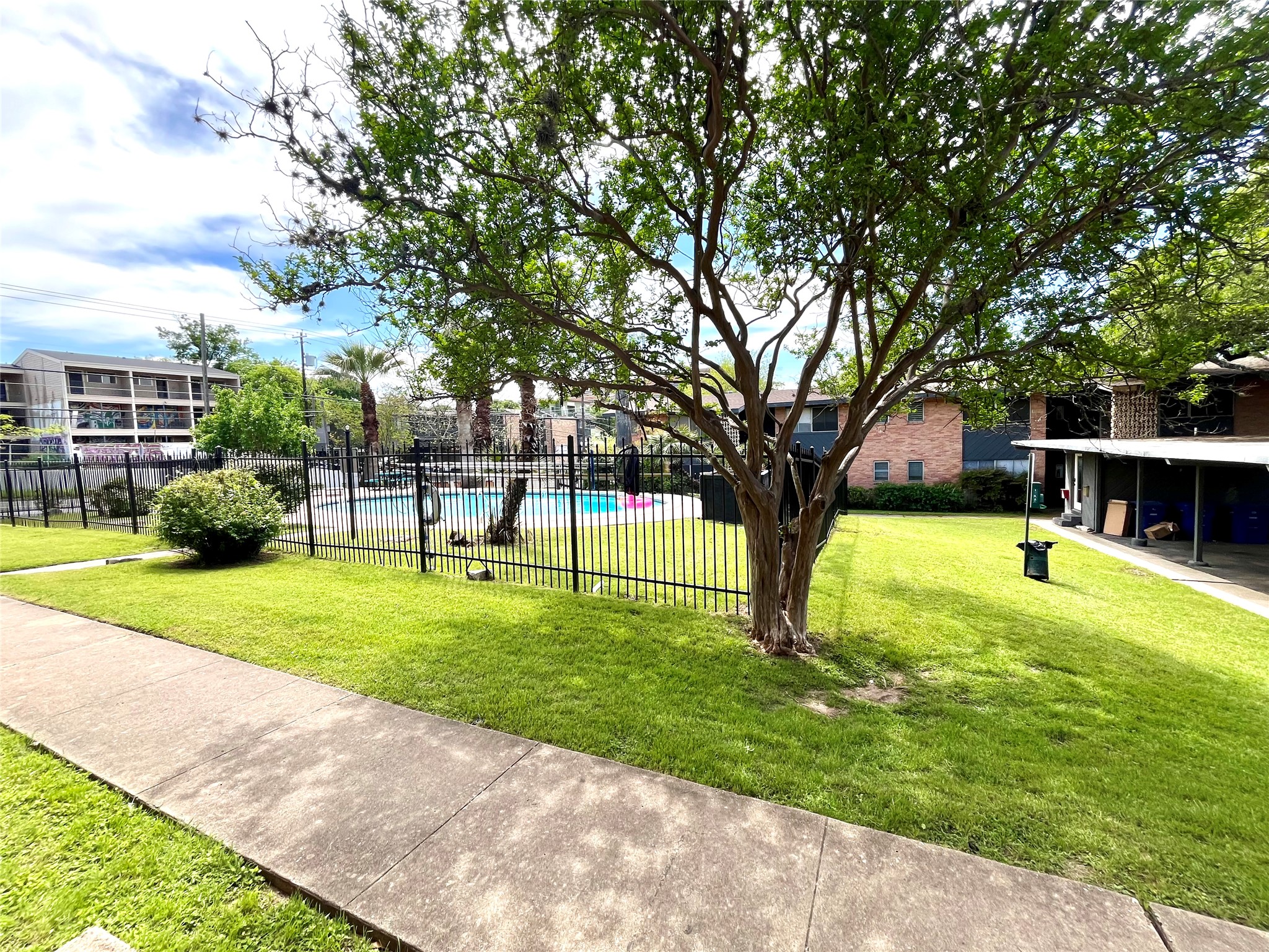 3304 Red River Street, Unit 203 Austin, TX 78705 - Photo 11 of 16 a view of a backyard with a garden