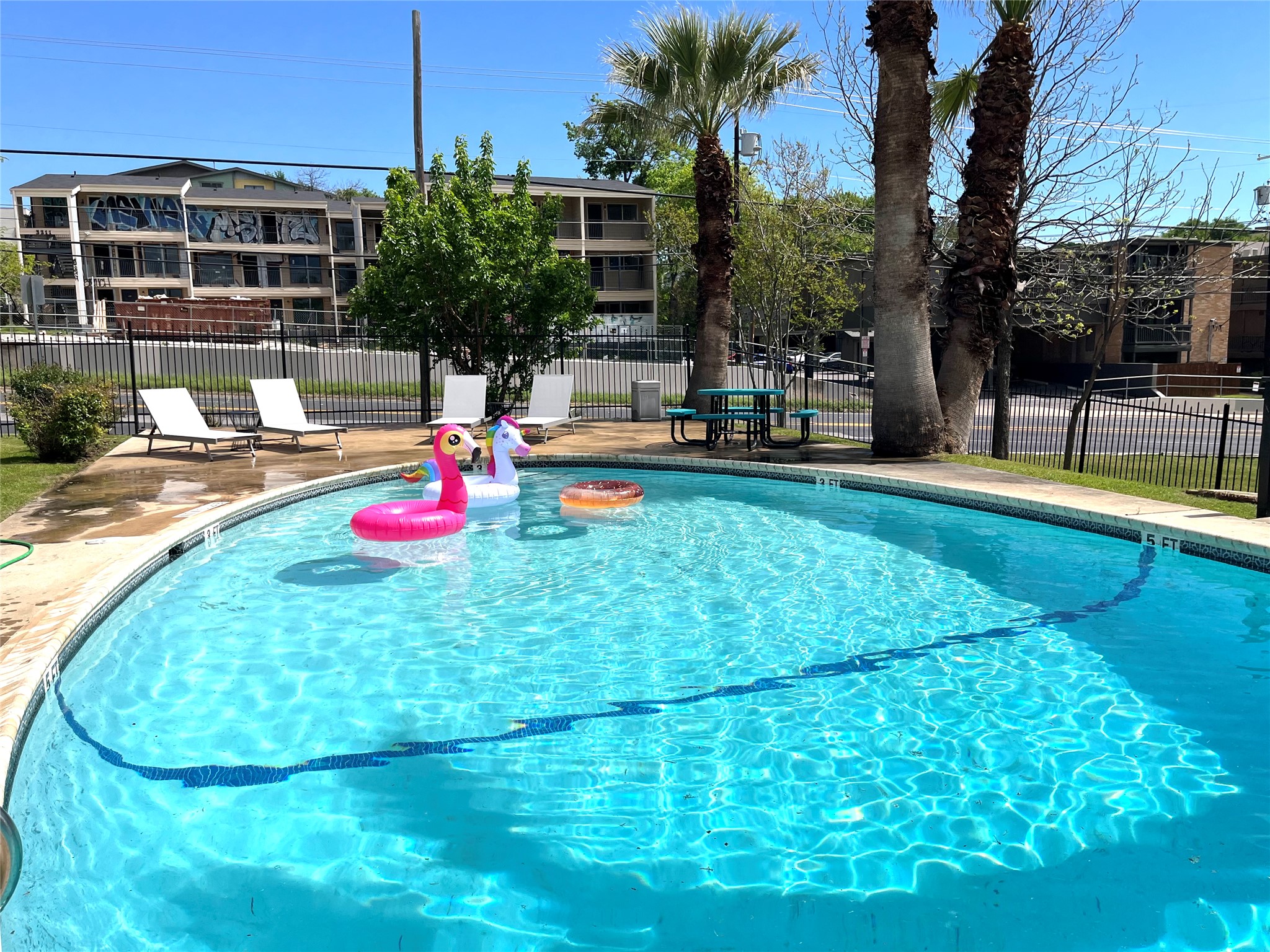 3304 Red River Street, Unit 203 Austin, TX 78705 - Photo 14 of 16 a view of a backyard with swimming pool