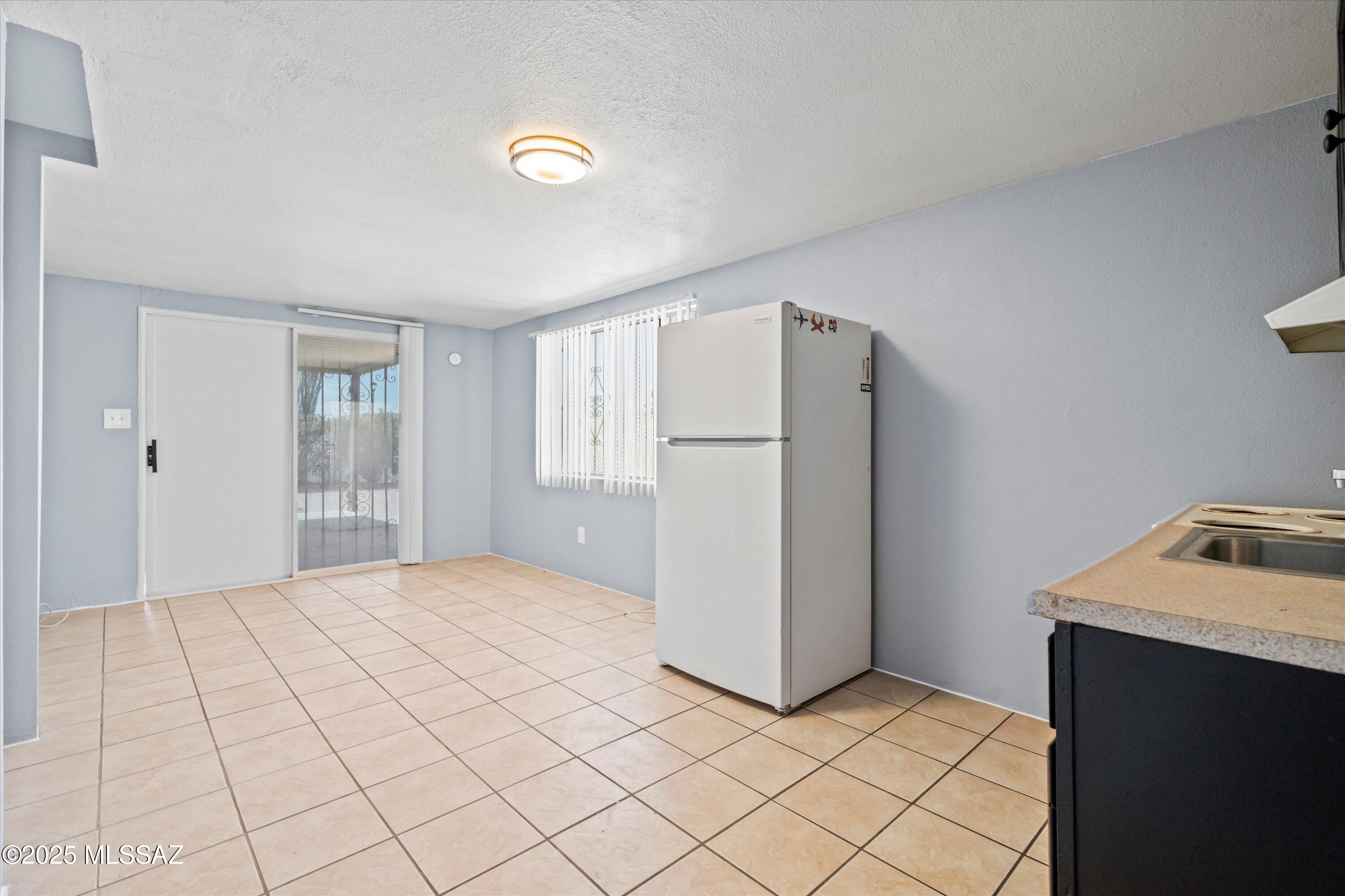 1227 East Ginter Road Tucson, AZ 85706 - Photo 6 of 18 a bedroom with a bed and a dresser