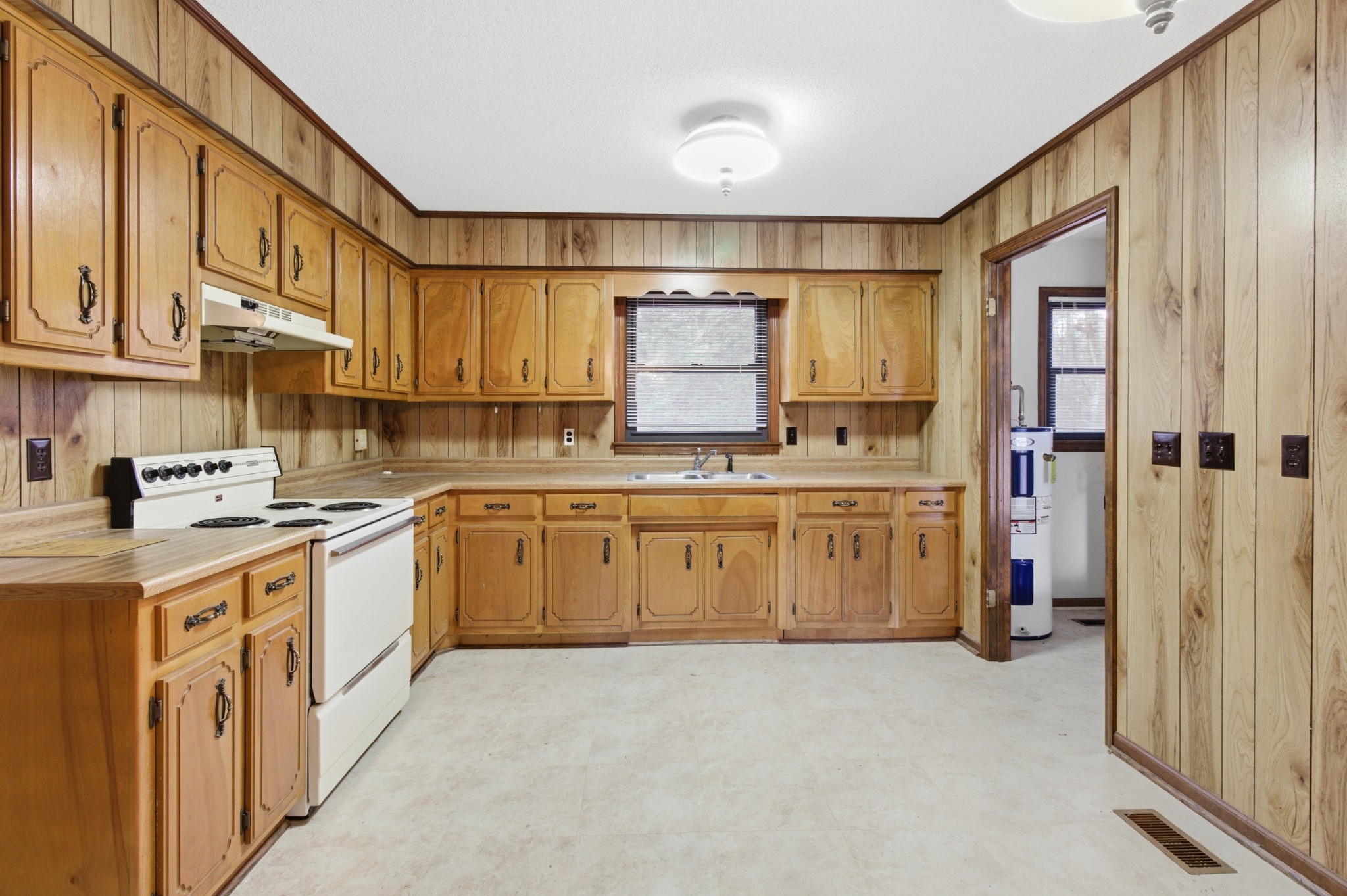 139 Magnolia Lane Normandy, TN 37360 - Photo 6 of 17 a kitchen with a sink a stove and cabinets