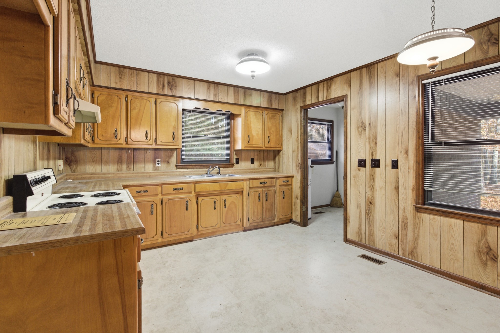 139 Magnolia Lane Normandy, TN 37360 - Photo 7 of 17 a kitchen with a refrigerator a sink and a window
