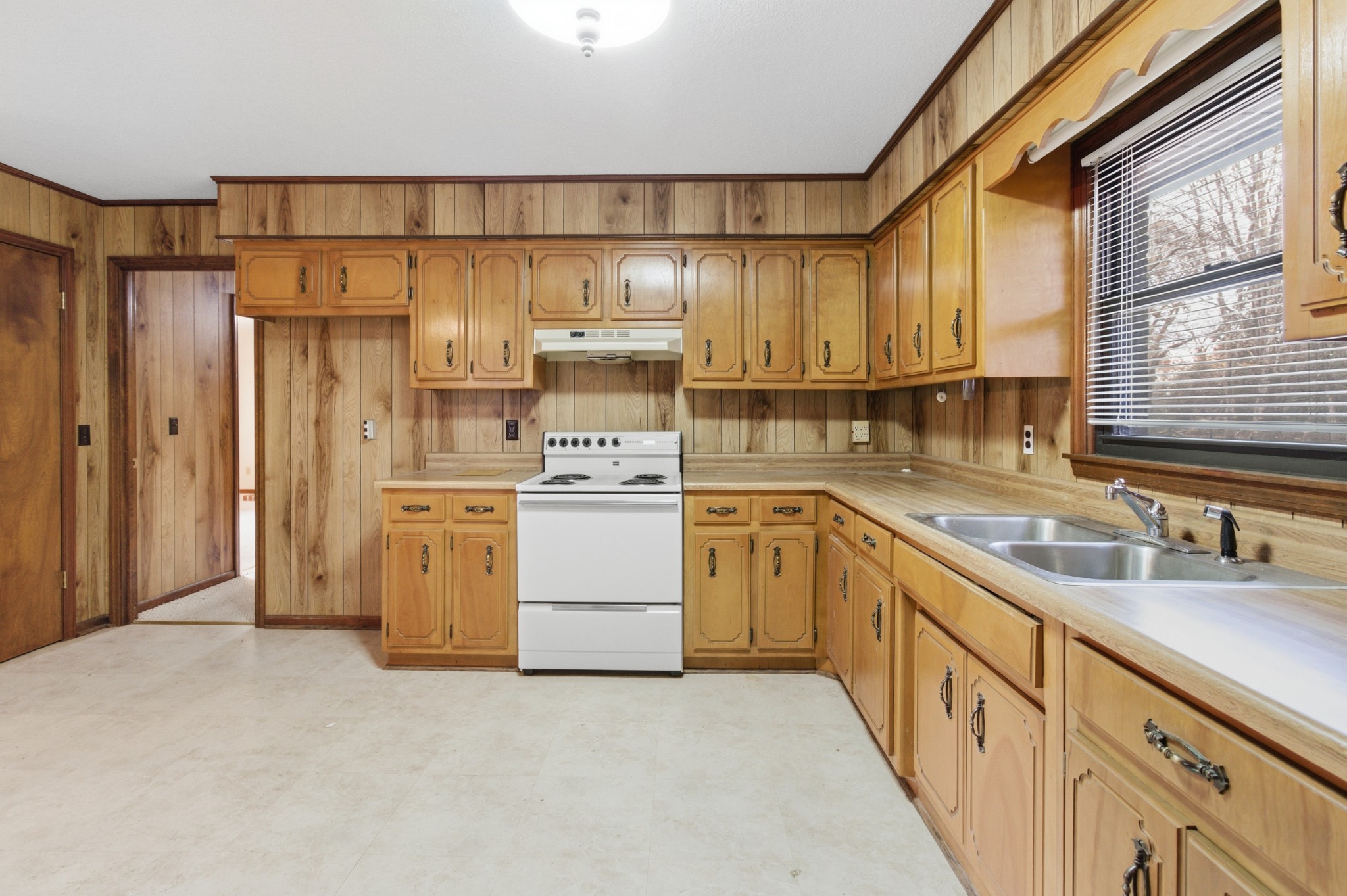 139 Magnolia Lane Normandy, TN 37360 - Photo 8 of 17 a kitchen with white cabinets and white appliances