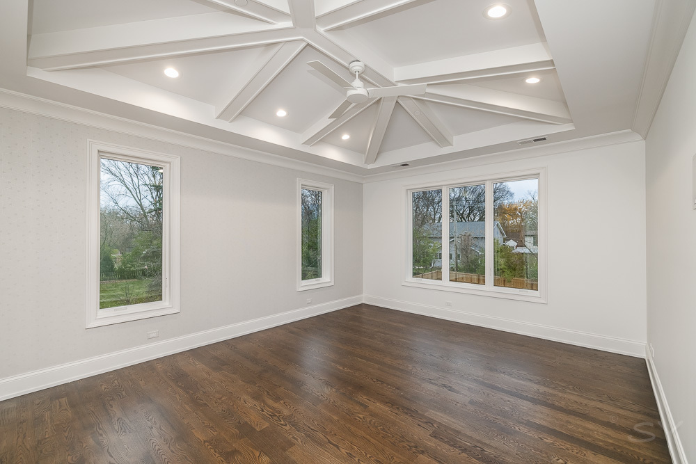 643 Abbotsford Road Kenilworth, IL 60043 - Photo 22 of 31 an empty room with wooden floor and windows