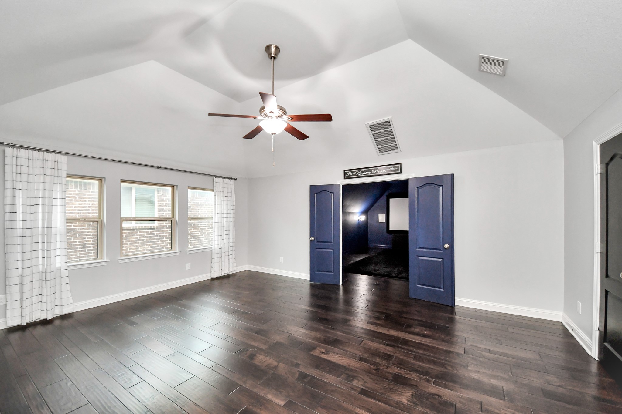 2811 Hadley Springs Lane Spring, TX 77386 - Photo 39 of 50 a view of an empty room with wooden floor fridge and a window