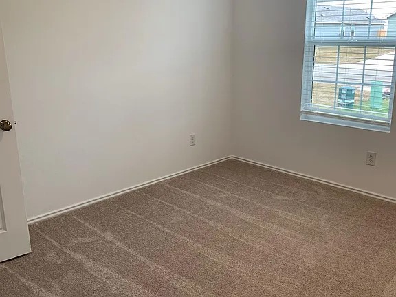 136 Texas Angel Way Jarrell, TX 76537 - Photo 11 of 12 an empty room with a window