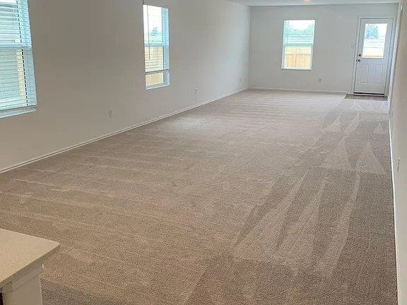 136 Texas Angel Way Jarrell, TX 76537 - Photo 6 of 12 an empty room with windows