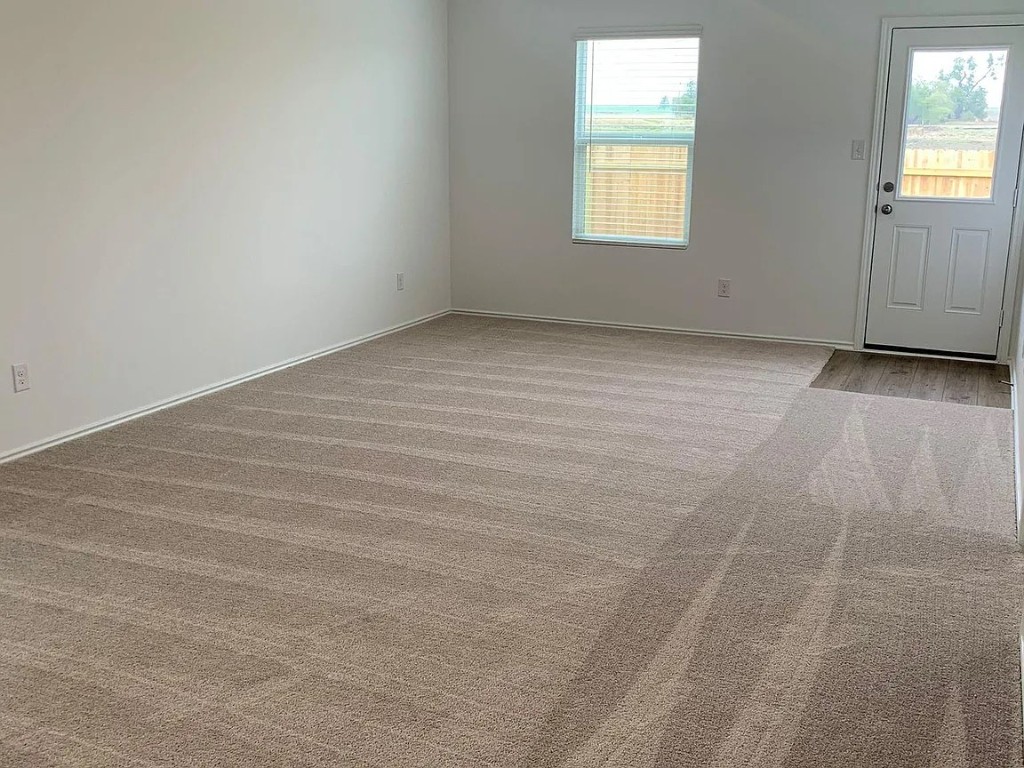 136 Texas Angel Way Jarrell, TX 76537 - Photo 9 of 12 an empty room with windows