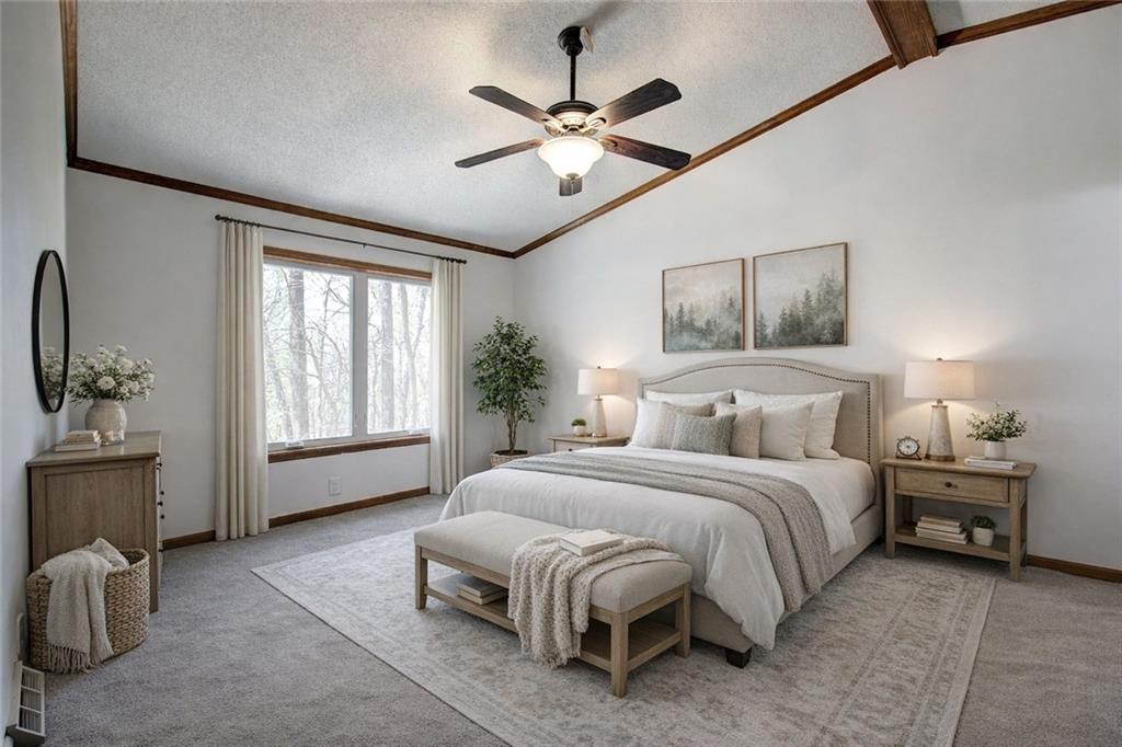 147 Laurel Mill Trail Jasper, GA 30143 - Photo 18 of 64 a spacious bedroom with a bed painting on wall and windows