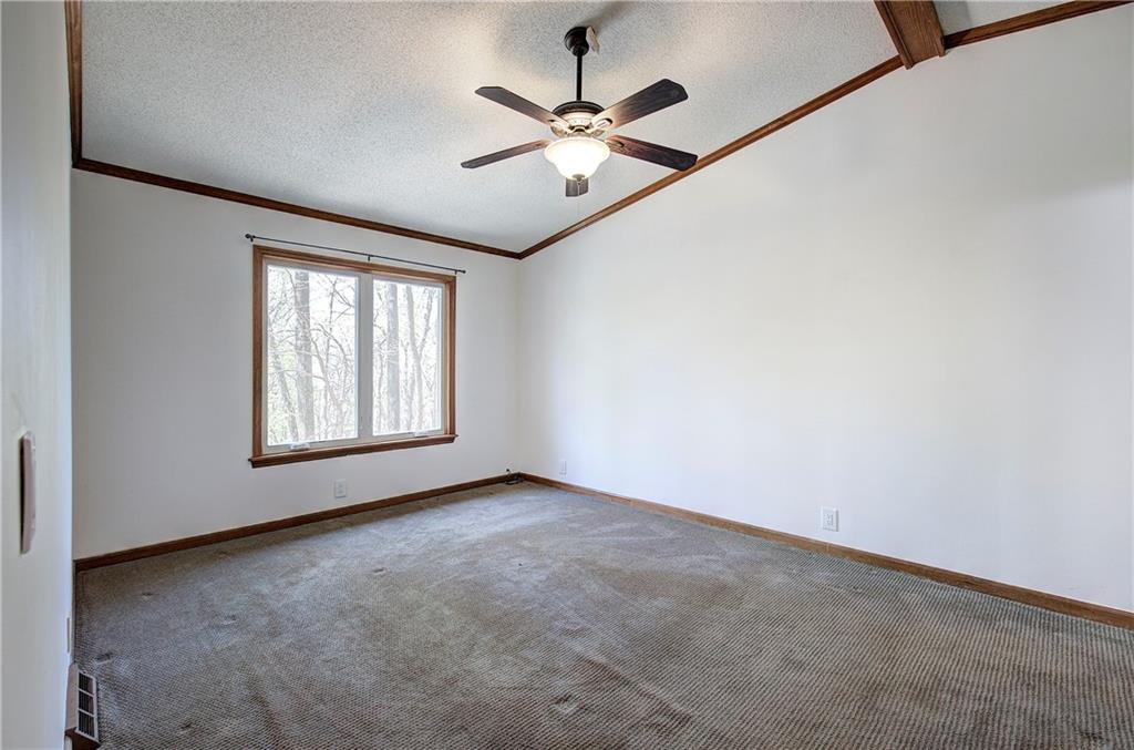 147 Laurel Mill Trail Jasper, GA 30143 - Photo 19 of 64 an empty room with ceiling fan and windows